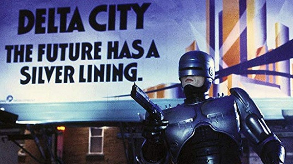 RoboCop in front of Delta City billboard