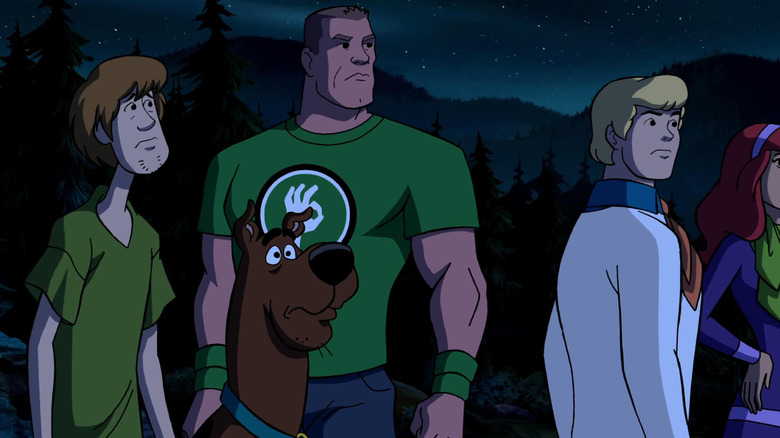 John Cena stands with Shaggy, Scooby Doo, Fred, and Daphne