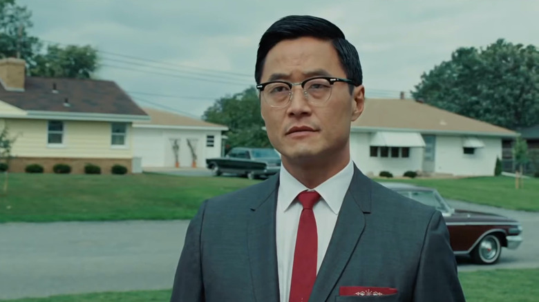 Stephen Park wears a suit and glasses