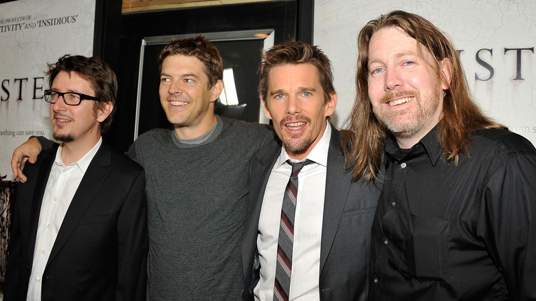 Scott Derrickson, Jason Blum, Ethan Hawke, and C. Robert Cargill posing