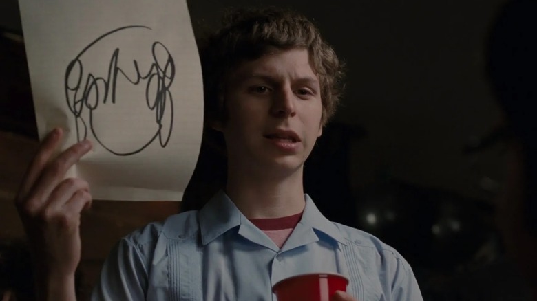 Scott Pilgrim holding drawing