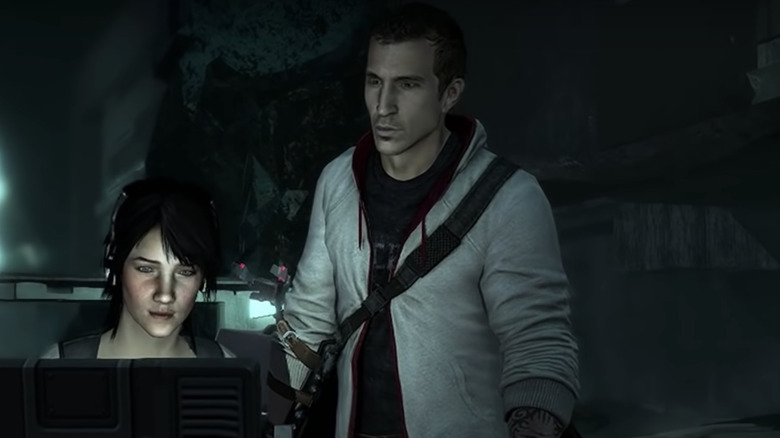 Desmond Miles looks over a woman's shoulder