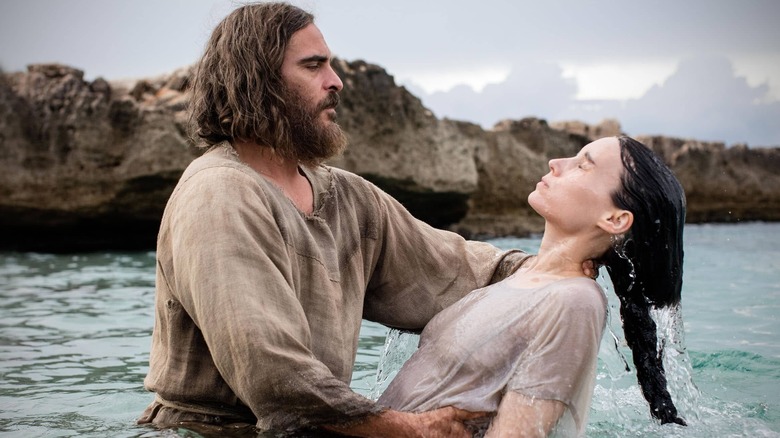 Joaquin Phoenix baptizing Rooney Mara