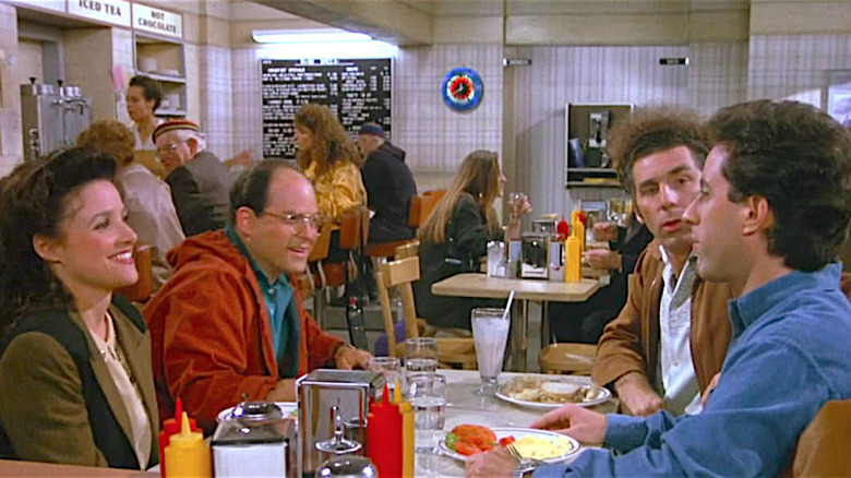 Seinfeld group sitting at dinner booth