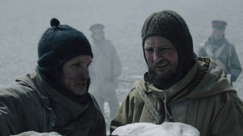 Morfin examining the cairn 