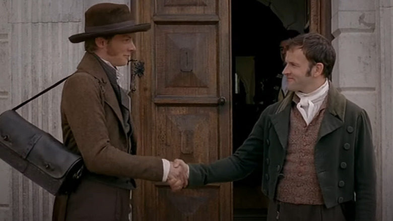 Robert Martin shaking hands with George Knightley