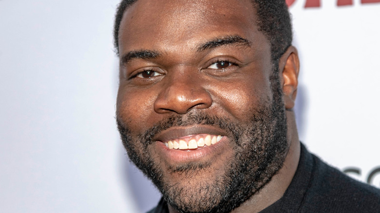 Sam Richardson smiling into camera