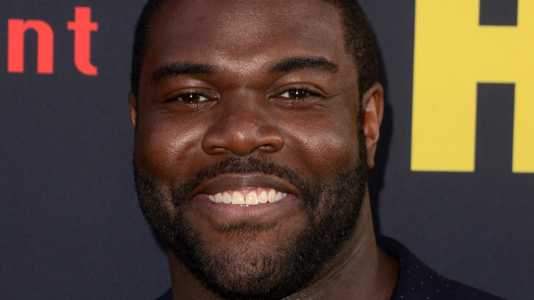 Sam Richardson smiling into camera