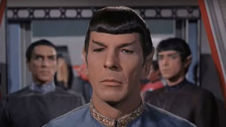 Spock standing in front of Vulcans