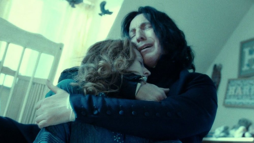 Alan Rickman as Severus Snape, cradling Lily Potter in Harry Potter and the Deathly Hallows