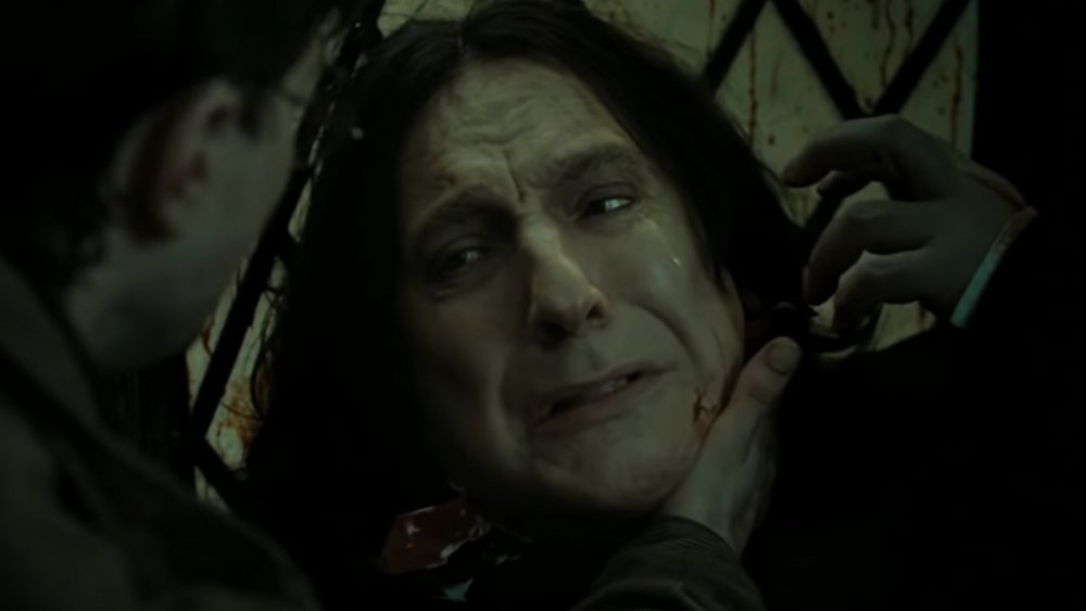 Alan Rickman as Severus Snape, dying in Harry's arms, in Harry Potter and the Deathly Hallows