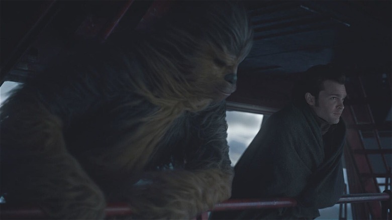 Chewie and Han standing over balcony