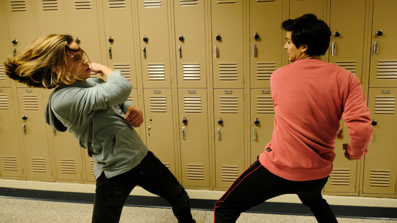 Tanner Buchanan and Xolo Maridueña fighting in Cobra Kai