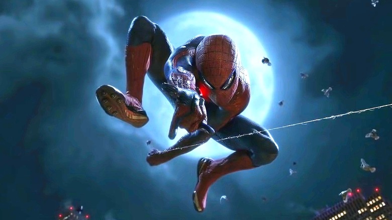 Spider-Man swinging under a full moon