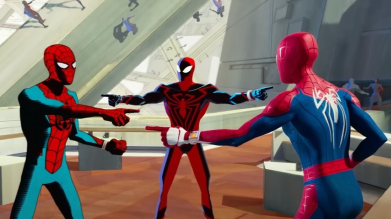 Spider-Men points at each other