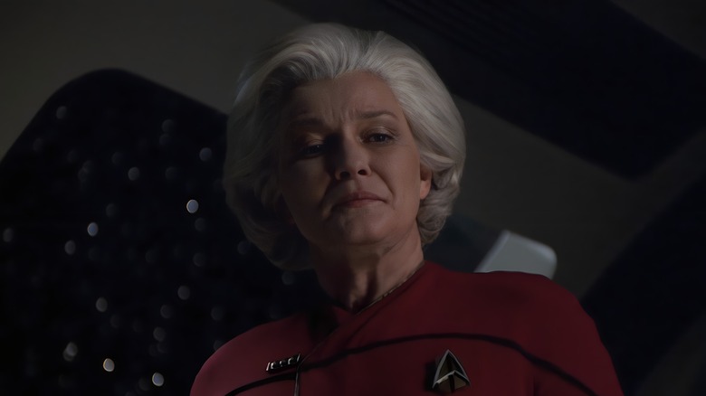 Admiral Janeway looks down