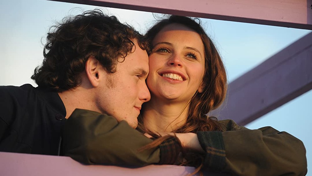 Felicity Jones as Anna smiling with Anton Yelchin as Jacob