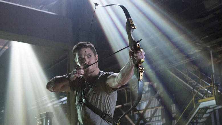 Oliver Queen readies his bow in "Arrow"