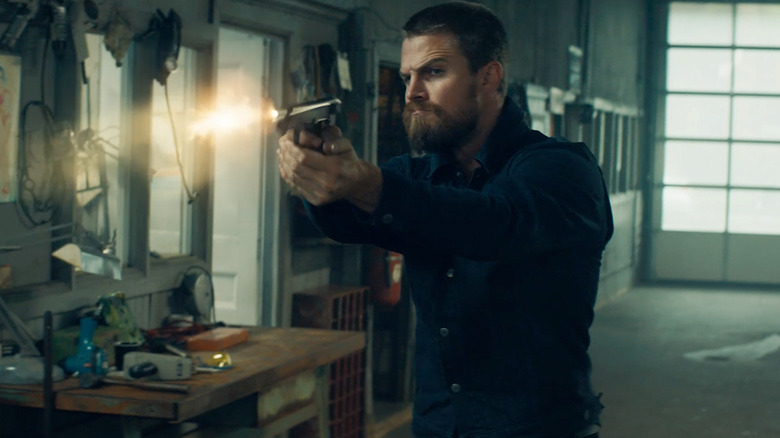 Garrett fires a gun in "Code 8"