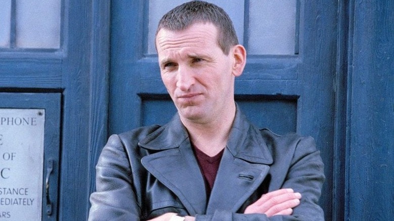 Ninth Doctor leaning on TARDIS