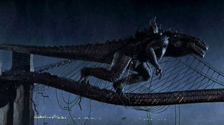 Godzilla tangled on a bridge