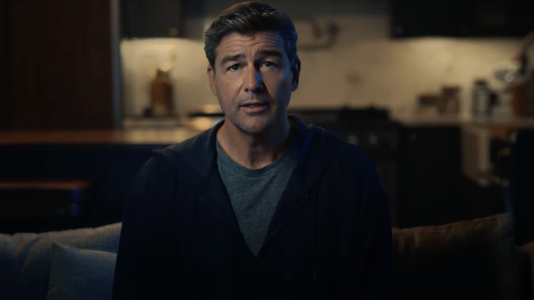 Kyle Chandler sitting on couch