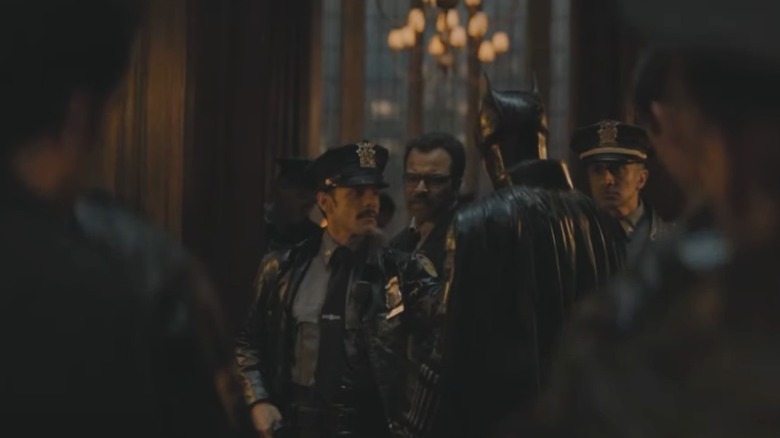 Officer Martinez and Jim Gordon near Batman