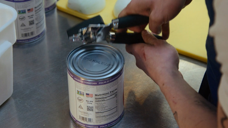 Opening a can of tomatoes