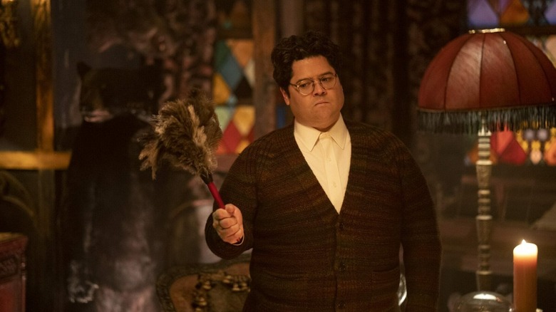 Guillermo wielding a feather-duster