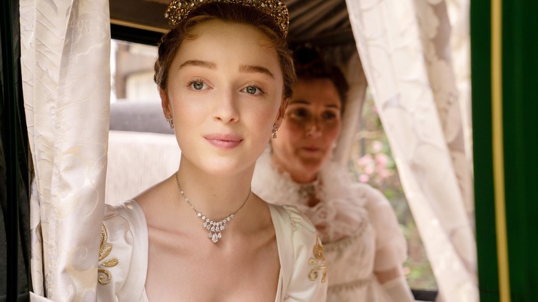 Daphne sitting in carriage with her mother