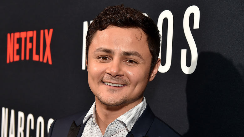 Arturo Castro wearing a navy blazer