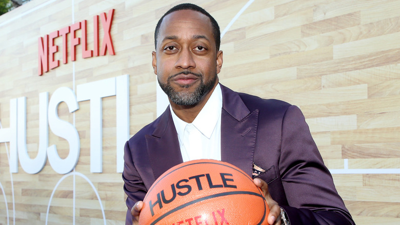 Jaleel White holding basketball at a premiere