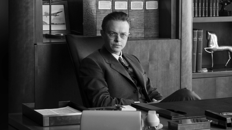 Kenneth Nichols sits at his desk