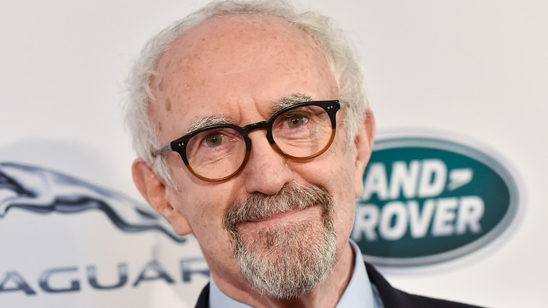 Jonathan Pryce wears glasses