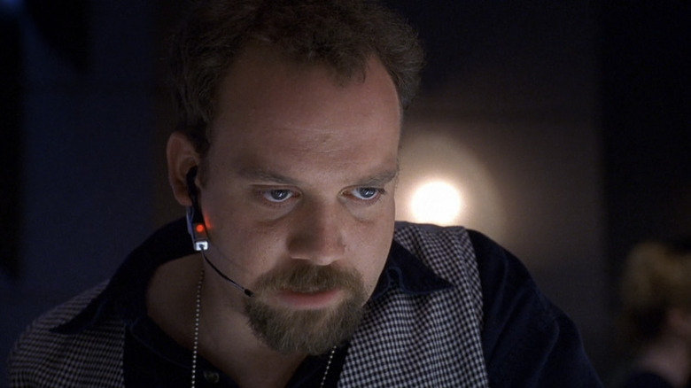 control room director Paul Giamatti talks into headset