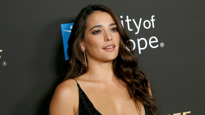 Natalie Martinez wearing a black dress