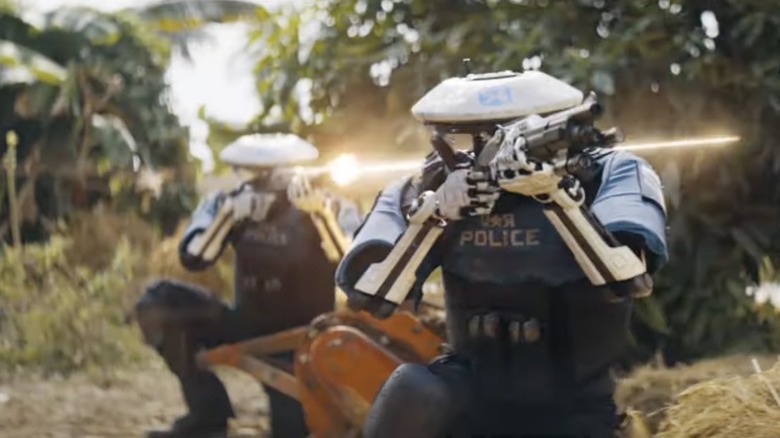 Police robots pointing guns