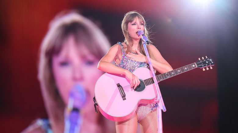 Taylor Swift with pink guitar