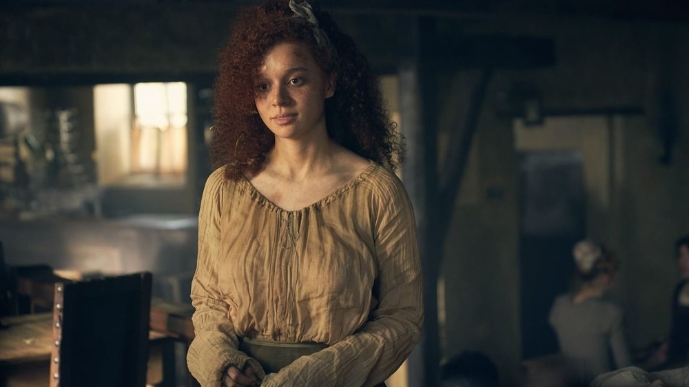 Erin Kellyman as Eponine smiling in Les Miserables