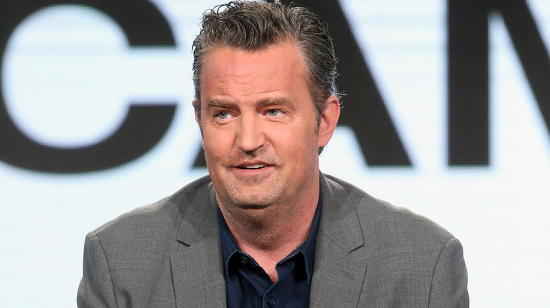 Matthew Perry sitting