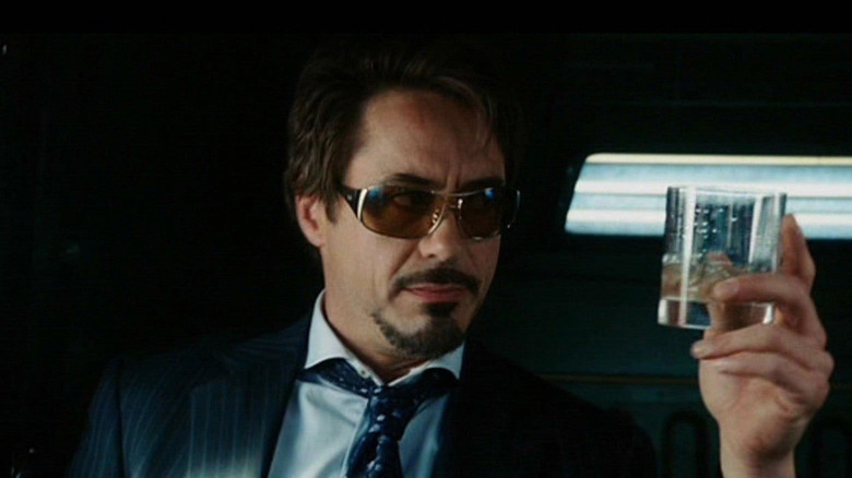 Tony Stark holding glass