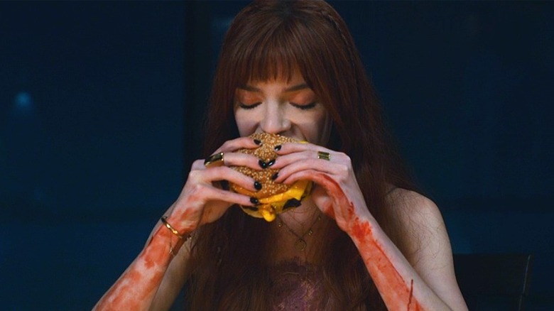 Anya Taylor-Joy eats a burger