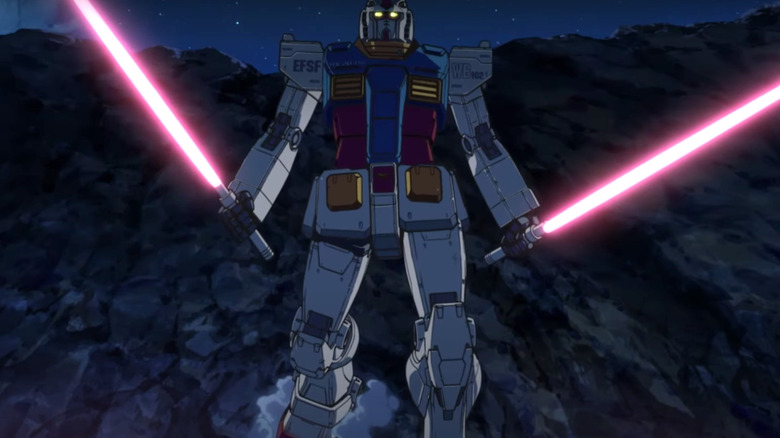 A Gundam approaches with blades drawn