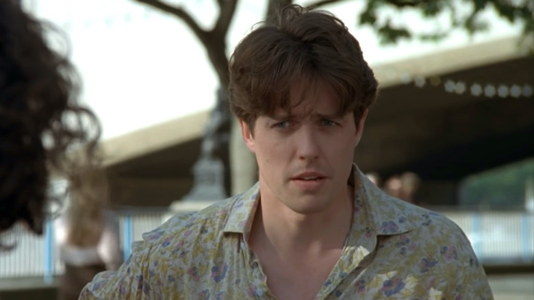 Hugh Grant wears a floral print shirt