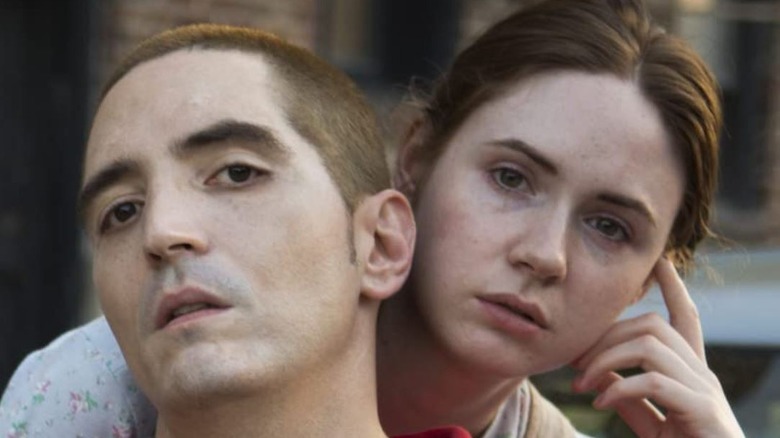 David Dastmalchian and Karen Gillan in "All Creatures Here Below" holding