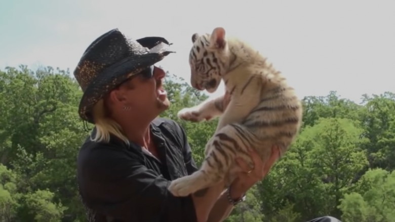 Joe Exotic holding a cub