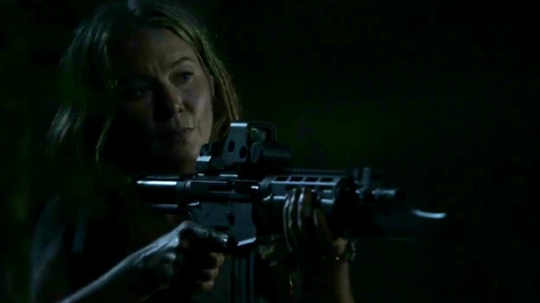 Leah Shaw holding a gun