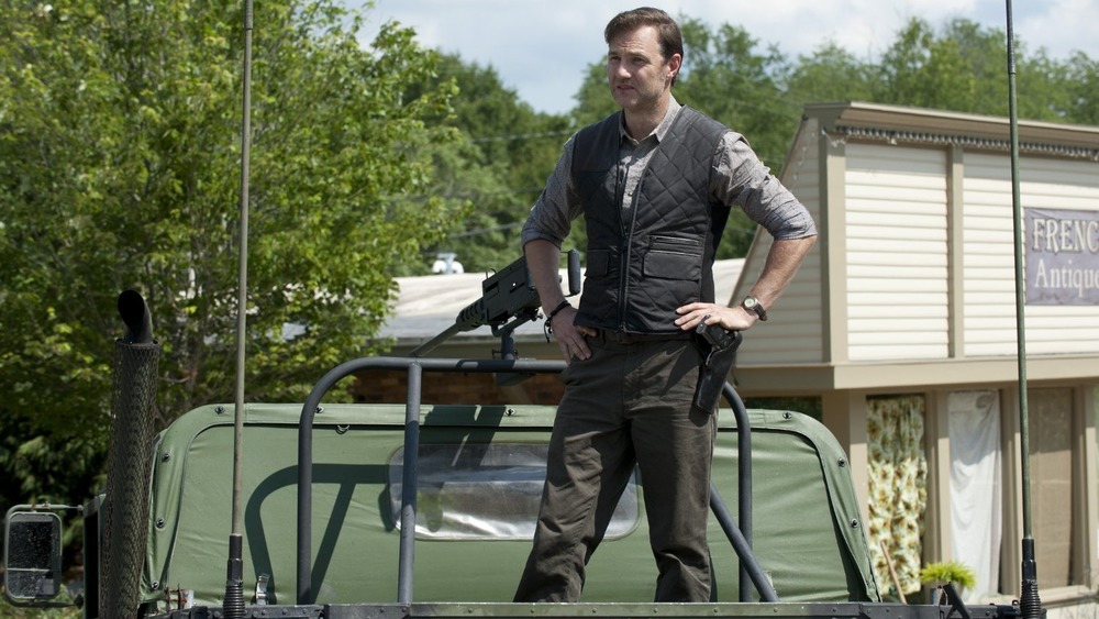 The Governor standing on truck