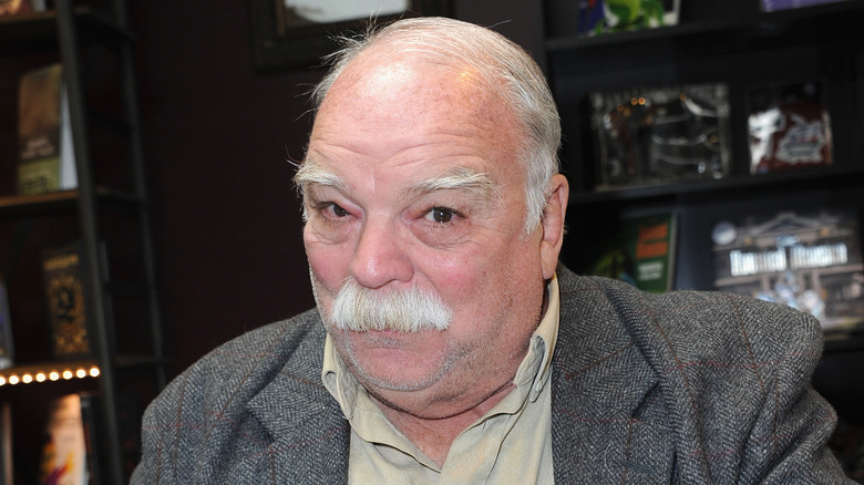 Richard Riehle smirks wryly