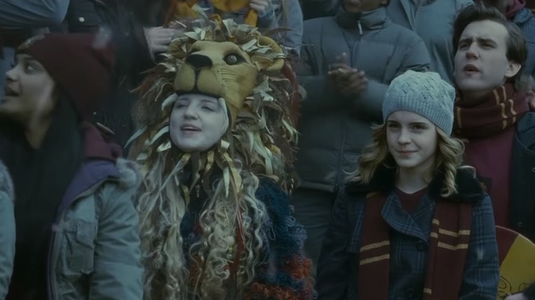 Luna Lovegood wearing lion headdress 